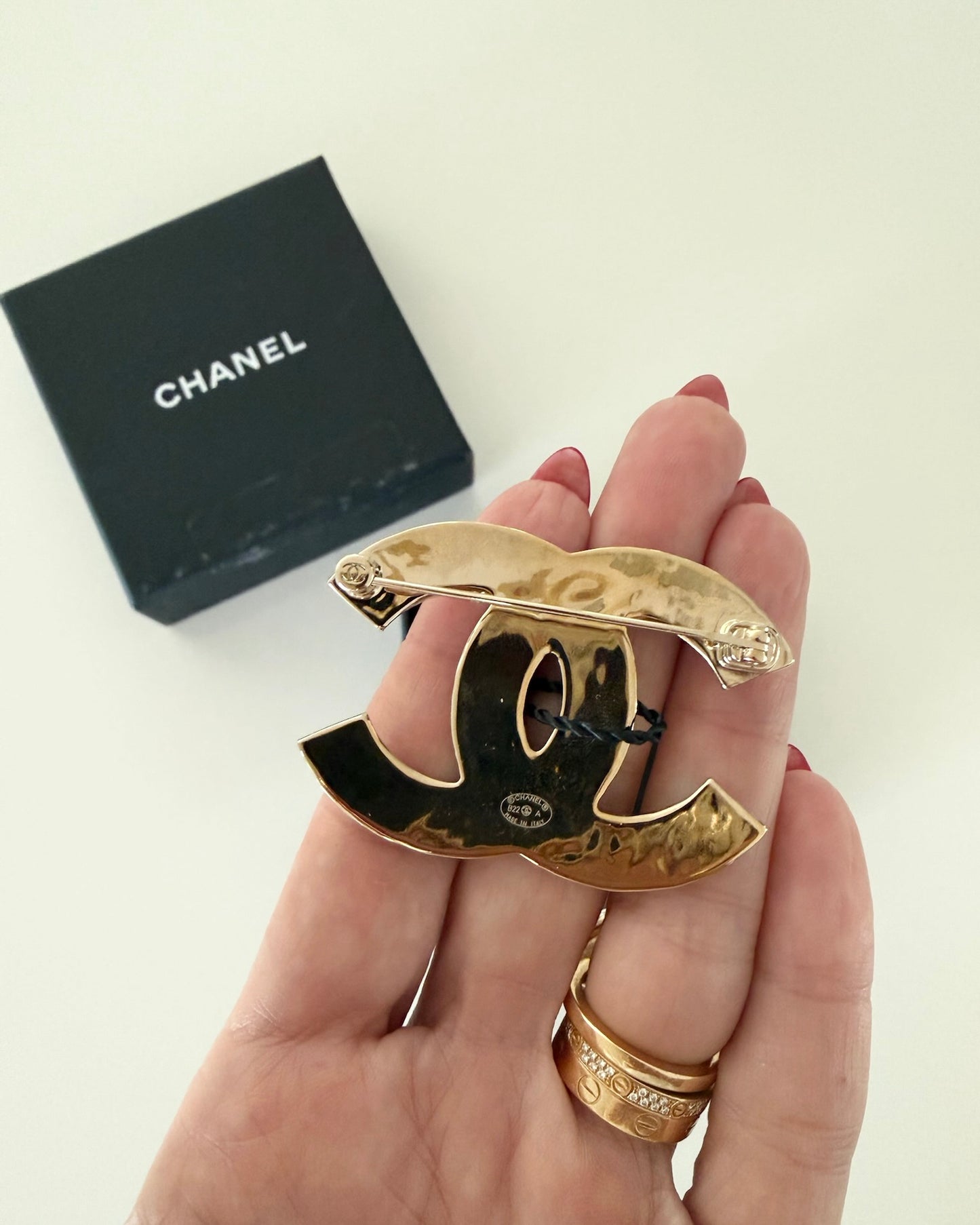 Chanel Gold Metal and Black Enamel Brooch from 2022